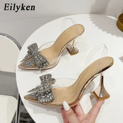 Eilyken Fashion Crystal Sequined Bowknot Women Pumps Sexy Pointed Toe High Heels PVC Transparent Sandals Wedding Prom Shoes Abysaz Kollectionz
